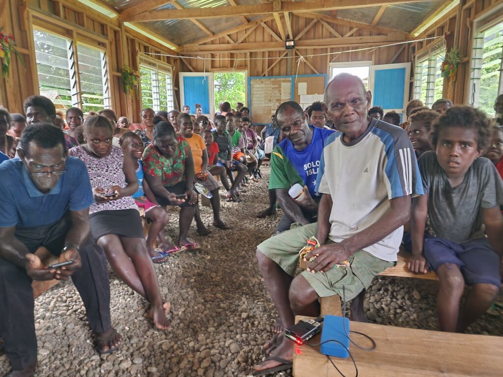 Lale villagers listening to stories from the Ranongga Oral History Project. 