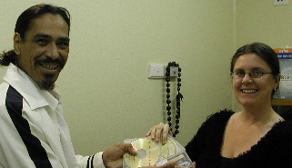 Tote Tepano receiving CD copies of his digitised tapes from Paradisec's Amanda Harris