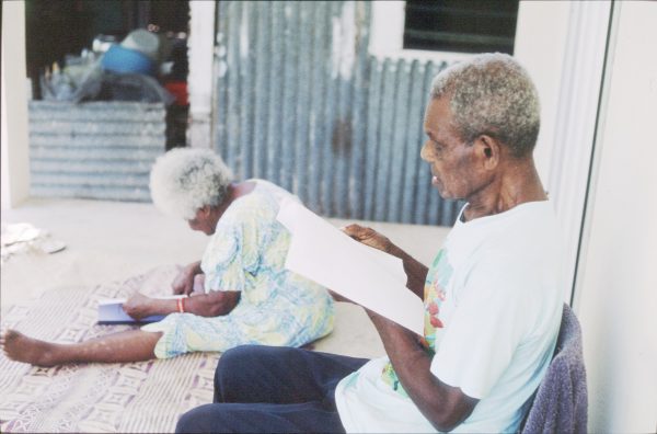 NT4-1_04-PIC Apu Kalsarap Nemaf and Limas Kalsarap reading a dictionary of their language. Erakor village, Vanuatu, 2001.